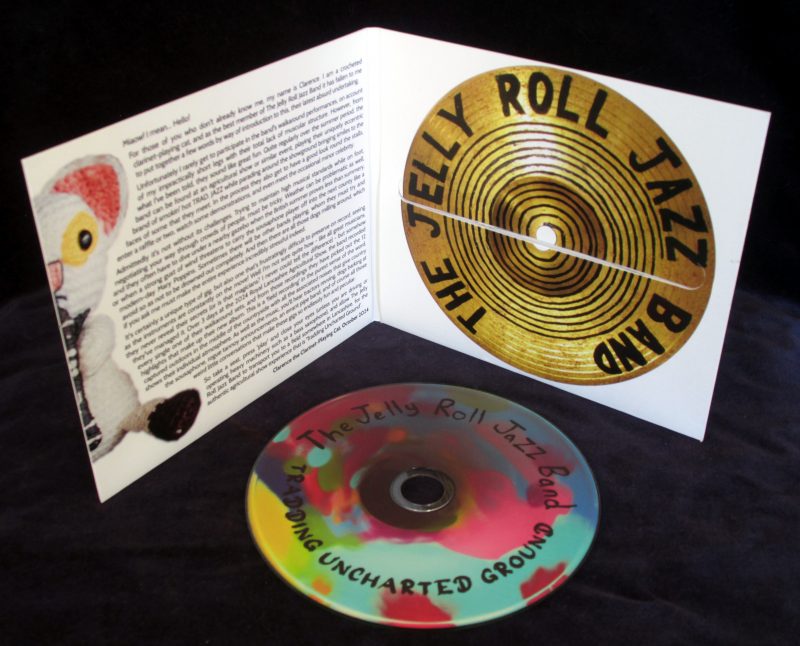 Inside the case of 'Tradding Uncharted Ground' by The Jelly Roll Jazz Band (CD copy), with the disc displayed separately.